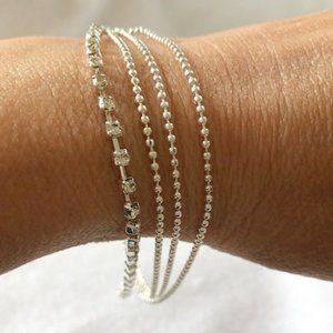 4 Strand silver tone bracelet with rhinestones
